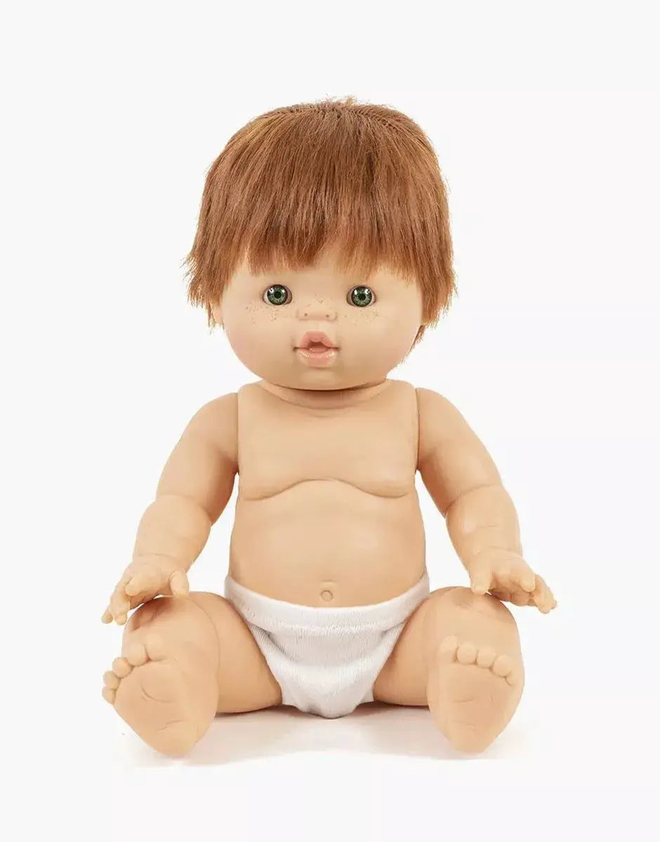 MINIKANE poupée 34 cm Raphaël, cheveux châtain, yeux verts, portant une couche blanche.