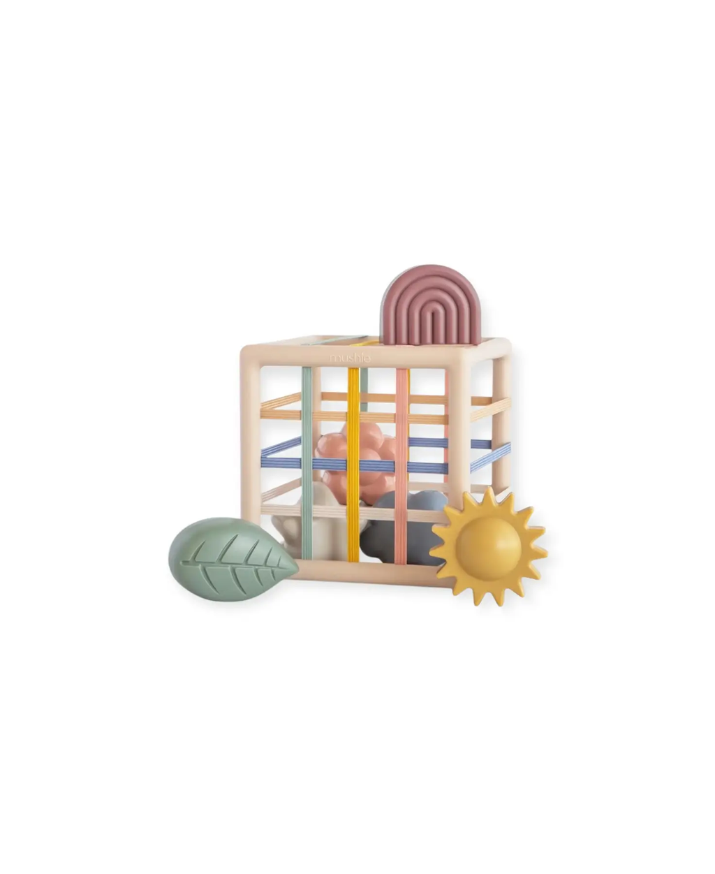 Mushie boîte à formes et élastiques, cadre beige avec bandes colorées et formes pastel (arc-en-ciel, soleil, feuille)