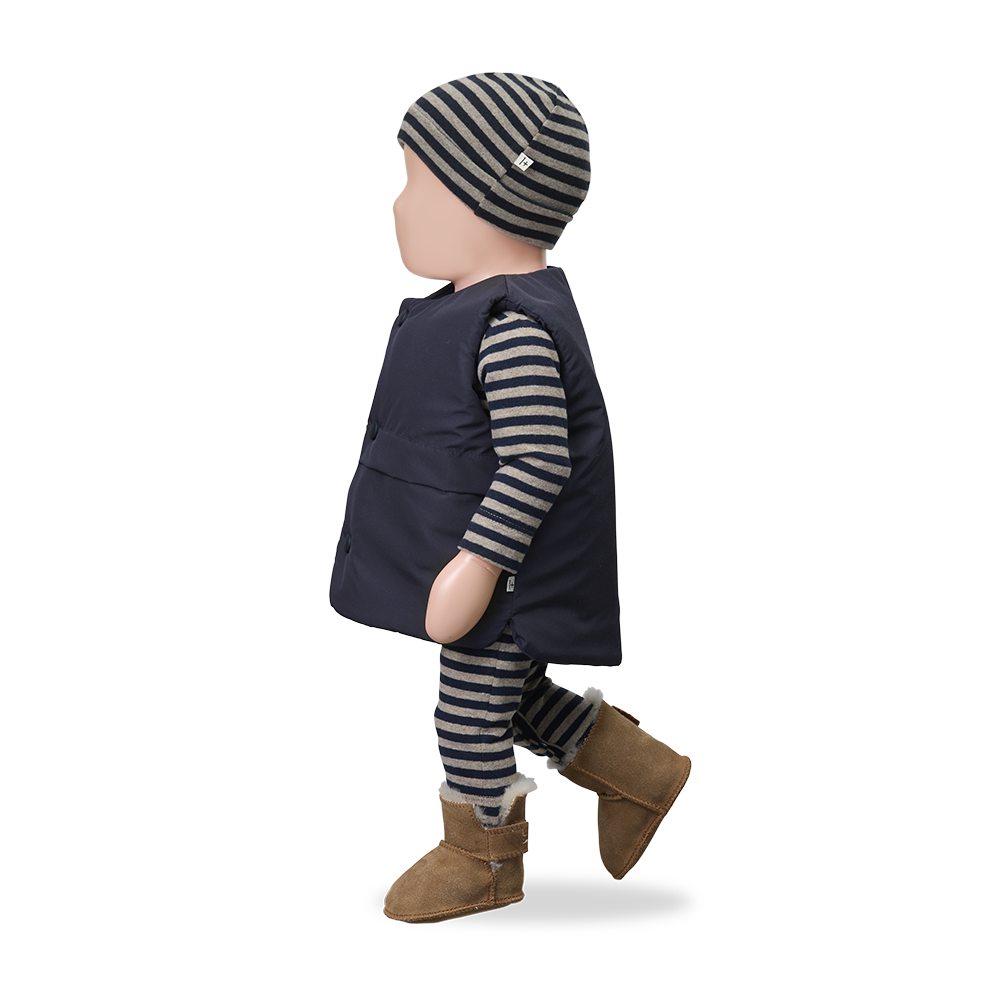 Treviso combi blue baby outfit: navy padded vest over striped knit set with hat and brown boots