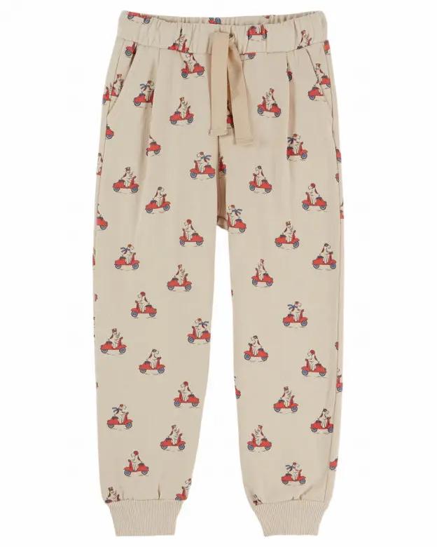 EMILE ET IDA jogger pants in beige with red scooter print by Citron Grenadine