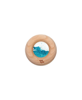 Petit Boum donut sensoriel en bois turquoise avec intérieur bleu scintillant, jouet de dentition