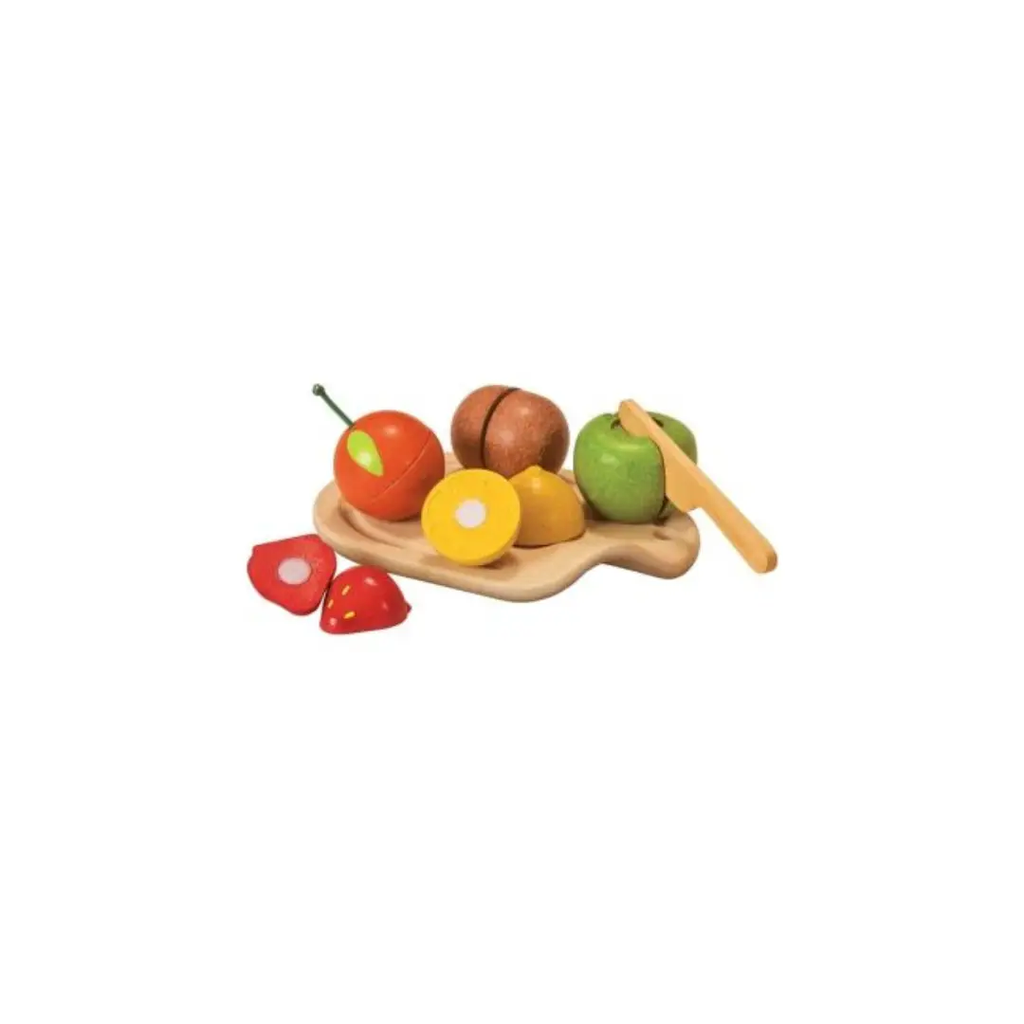 Plan Toys wooden fruit cutting set on a natural cutting board with knife; colorful pretend fruits in red, green and yellow