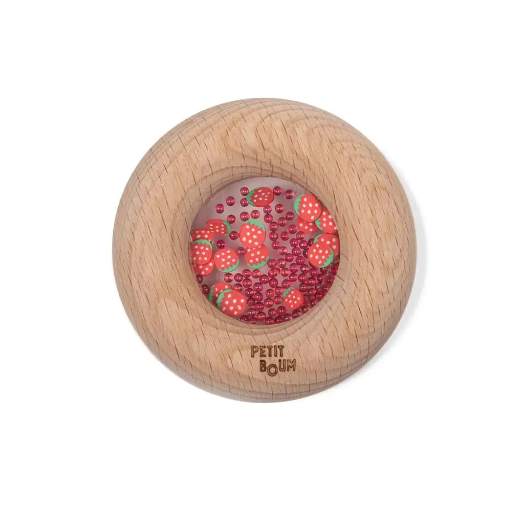 Petit Boum donut sensoriel en bois avec centre transparent rempli de fraises et perles rouges