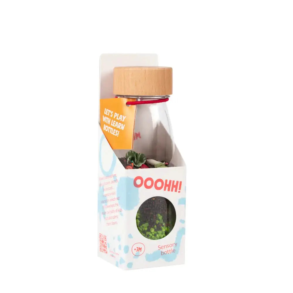 Petit Boum sensory learn bottle with veggies by Citron Grenadine; transparent bottle with wooden cap in a white box